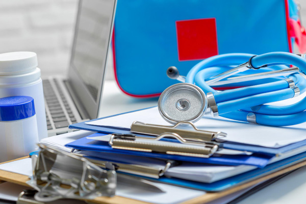 Medical supplies and equipment neatly arranged on a desk, ready for use in a healthcare setting.